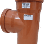 A close-up image of a CM108 drainage fitting, showcasing its durable orange material. This product is essential for effective water drainage in installations featuring Pattern Imprinted Concrete. Ideal for ensuring proper water management in decorative concrete applications, it complements the range of PICS products designed to enhance the longevity and aesthetics of outdoor spaces.